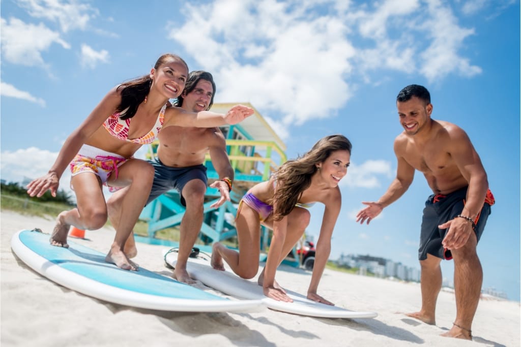 12 Beginner-Friendly Surfing Tips To Maximize Your Vacation Fun